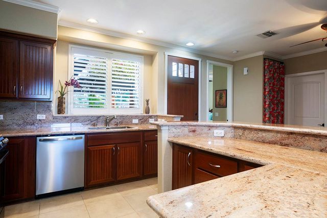 a kitchen with large window
