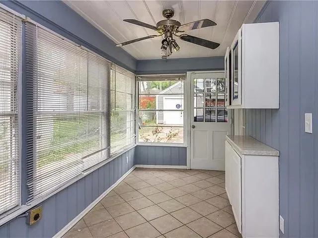 a view of an empty room with a window