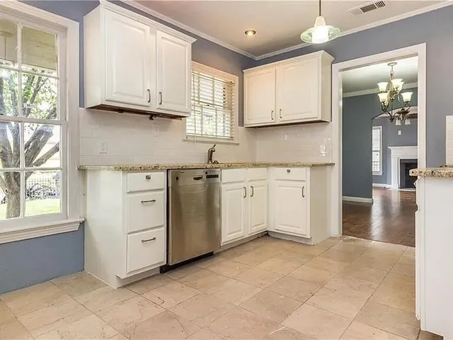 a view of a kitchen with electric appliances