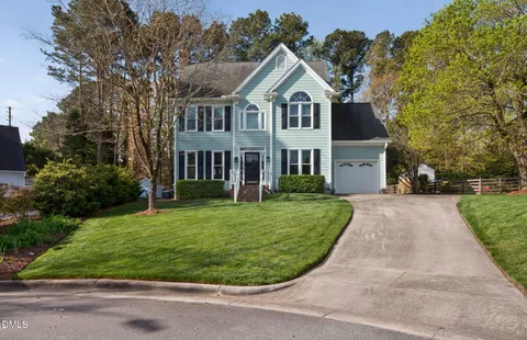 front view of a house with a garden