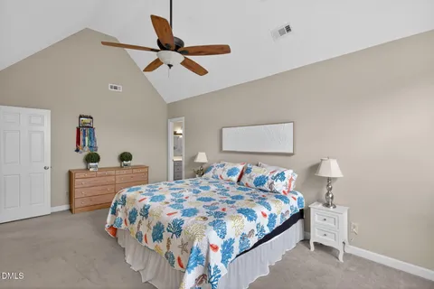 a bedroom with bed and a window