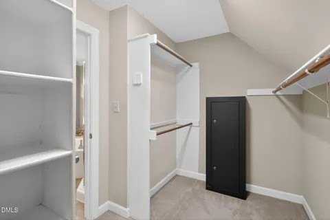 a bathroom with a tub a double vanity sink a window and a mirror