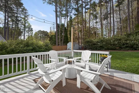 a view of a patio with table and chairs and potted plants