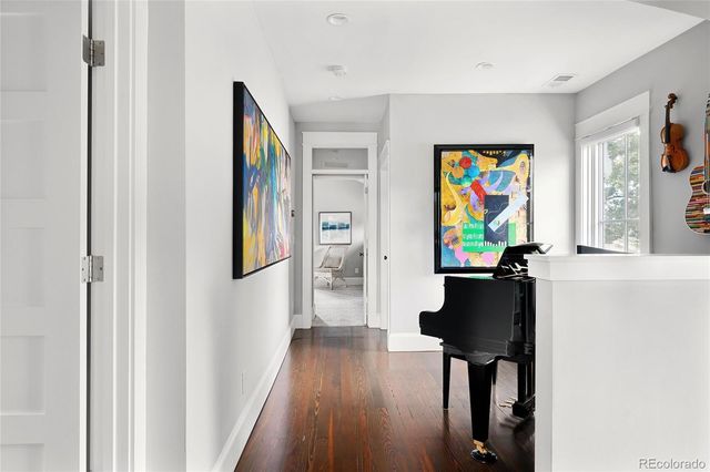 a view of an entryway with wooden floor