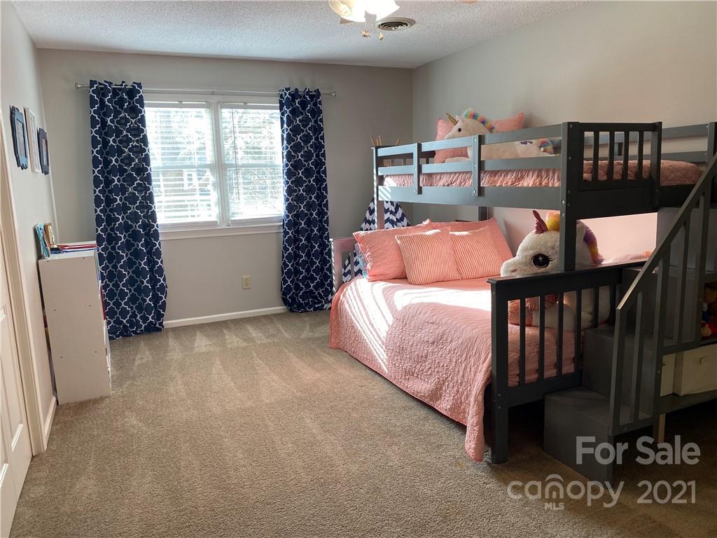 1507 Melchor Road Albemarle, NC 28001 - Photo 12 of 20 a bed room with a bed and a window