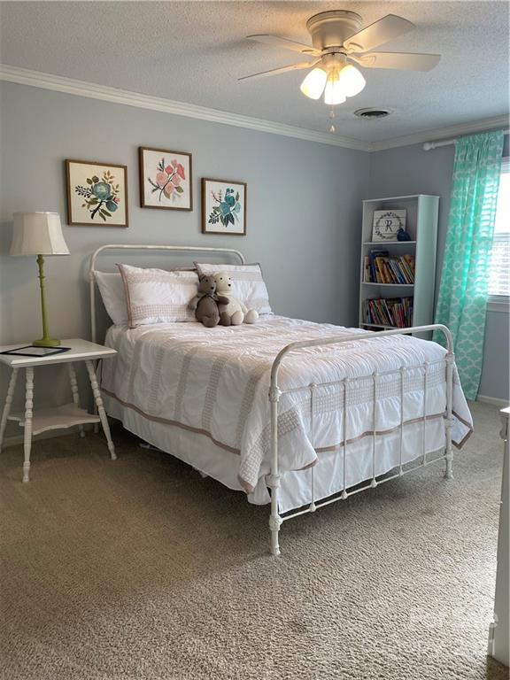 1507 Melchor Road Albemarle, NC 28001 - Photo 14 of 20 a bedroom with a bed and a chandelier