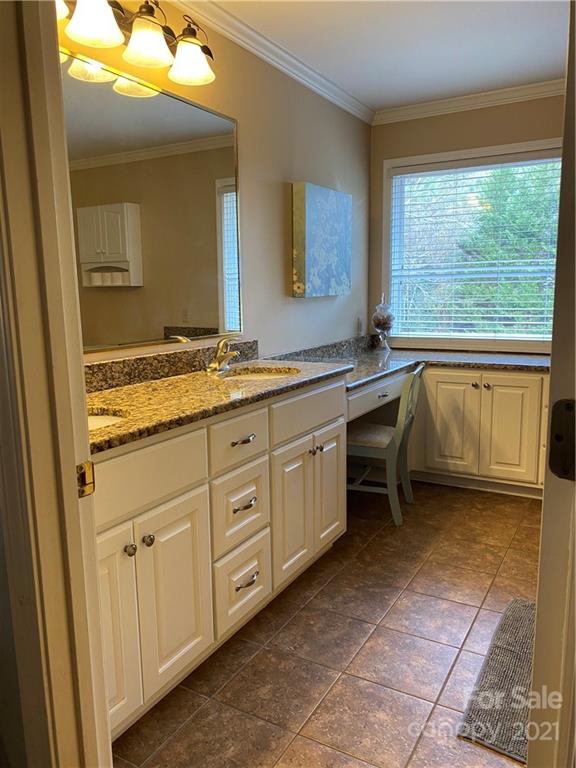 1507 Melchor Road Albemarle, NC 28001 - Photo 4 of 20 a spacious bathroom with a granite countertop sink mirror and a bathtub