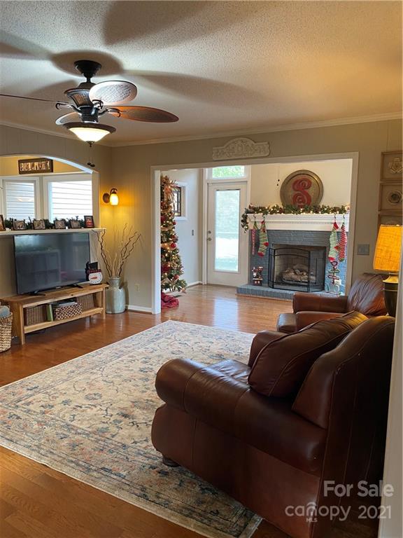 1507 Melchor Road Albemarle, NC 28001 - Photo 6 of 20 a living room with furniture and a fireplace