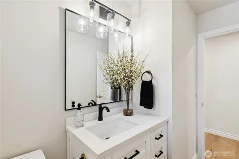 a bathroom with a sink and mirror