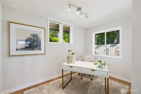 a workspace with furniture and window