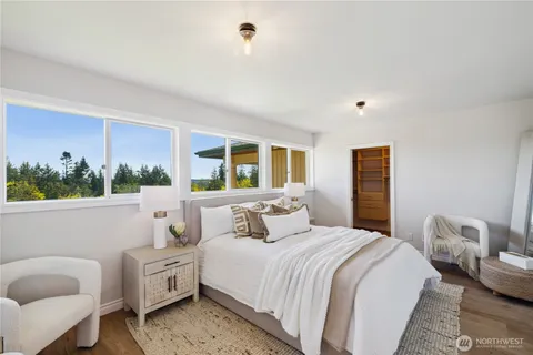 a bedroom with a bed and a couch