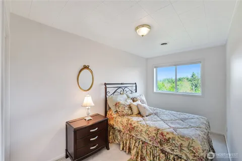 a bed room with a bed and a window
