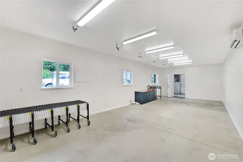 a view of a livingroom with furniture and a window