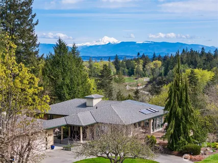 a view of a table and chairs under an umbrella
