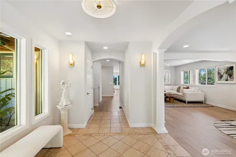 a view of a bedroom with furniture and window