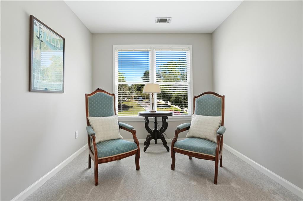 3660 Chartwell Drive Suwanee, GA 30024 - Photo 17 of 50 a living room with furniture and a window