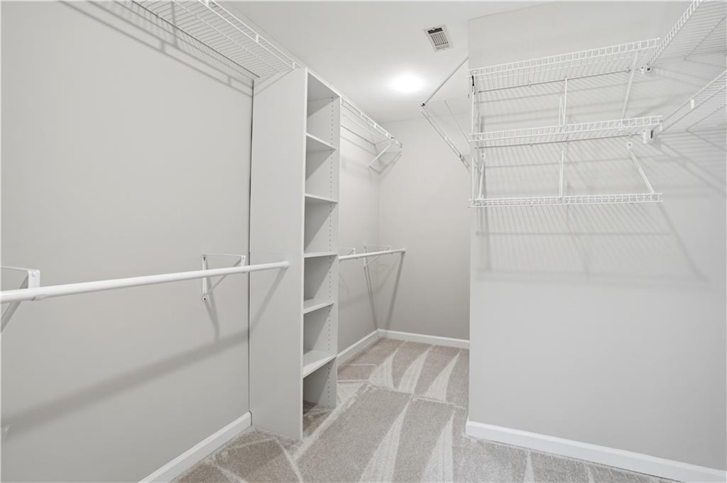 3660 Chartwell Drive Suwanee, GA 30024 - Photo 18 of 50 a view of a room with racks on the wall