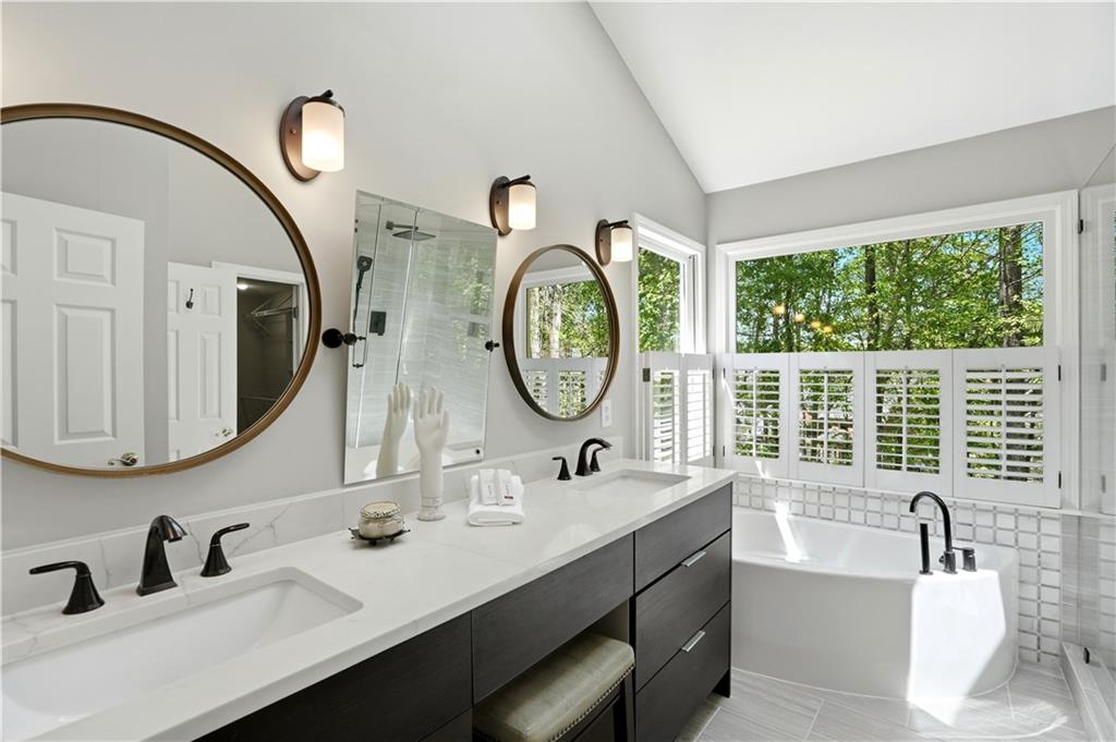 3660 Chartwell Drive Suwanee, GA 30024 - Photo 20 of 50 a bathroom with a double vanity sink and a mirror