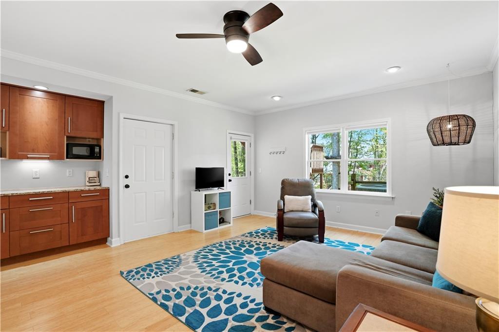 3660 Chartwell Drive Suwanee, GA 30024 - Photo 26 of 50 a living room with furniture and a flat screen tv