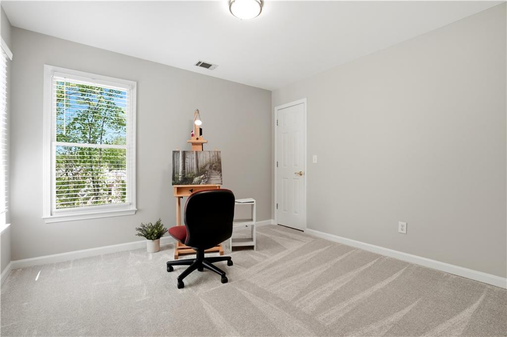 3660 Chartwell Drive Suwanee, GA 30024 - Photo 33 of 50 a view of a workspace with furniture and a window
