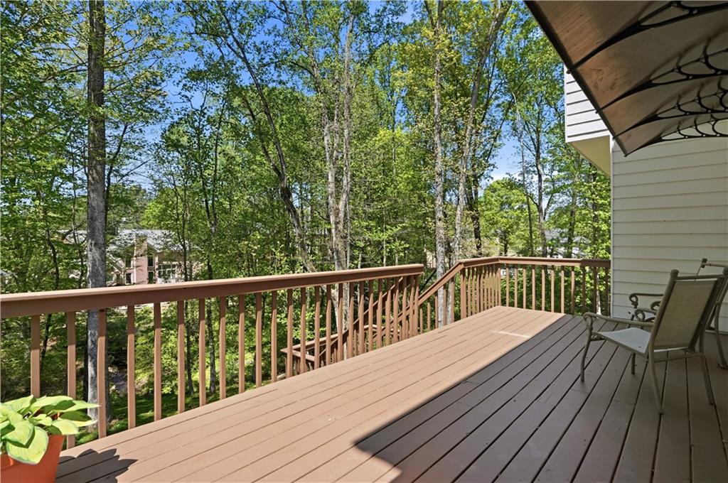 3660 Chartwell Drive Suwanee, GA 30024 - Photo 39 of 50 a view of balcony with wooden floor and outdoor seating