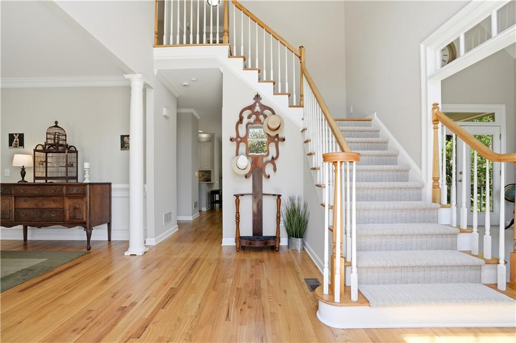 3660 Chartwell Drive Suwanee, GA 30024 - Photo 4 of 50 a view of entryway and hall with wooden floor