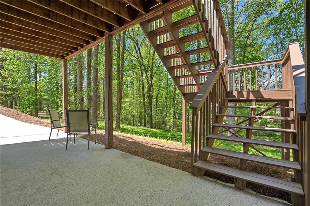 3660 Chartwell Drive Suwanee, GA 30024 - Photo 43 of 50 a view of a porch with furniture and garden