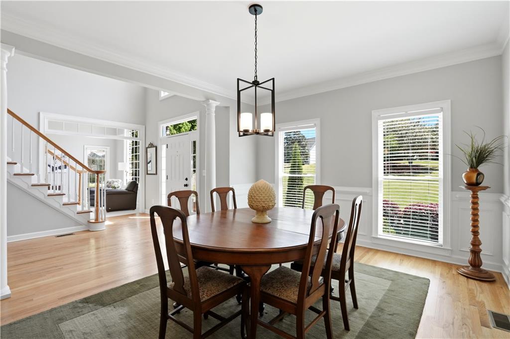 3660 Chartwell Drive Suwanee, GA 30024 - Photo 5 of 50 a view of a dining room with furniture window and wooden floor