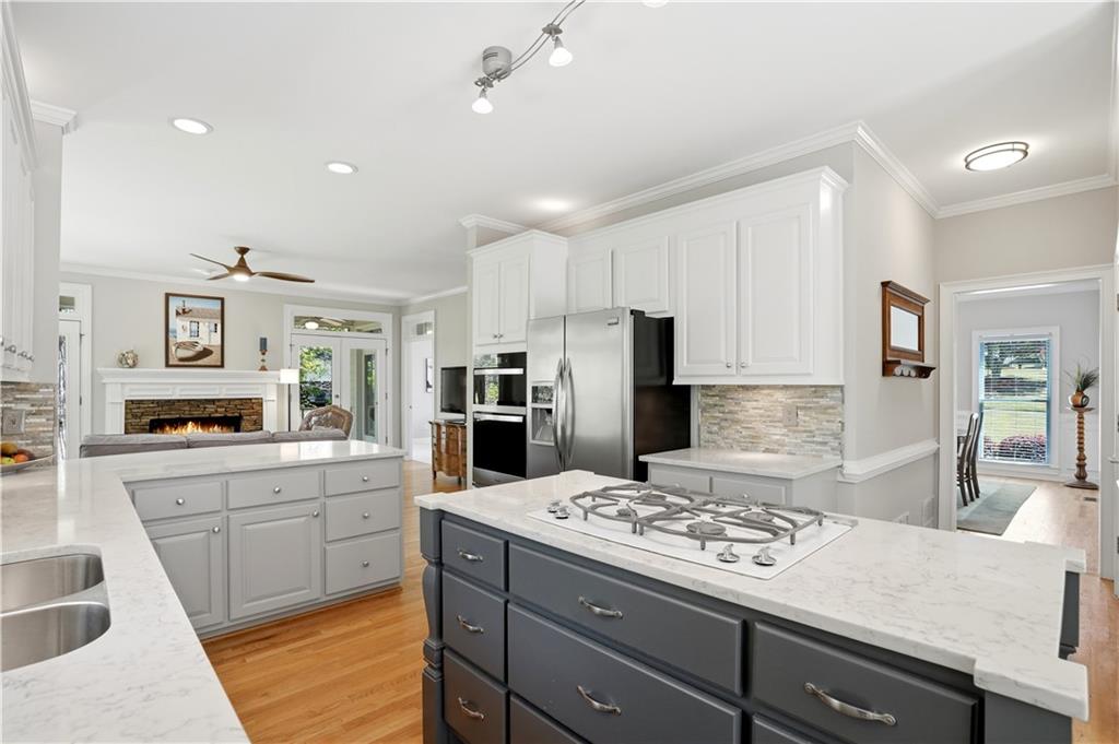3660 Chartwell Drive Suwanee, GA 30024 - Photo 8 of 50 a kitchen with a sink stove and refrigerator