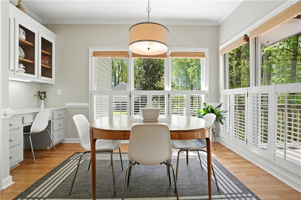 3660 Chartwell Drive Suwanee, GA 30024 - Photo 9 of 50 a view of a dining room with furniture window and wooden floor