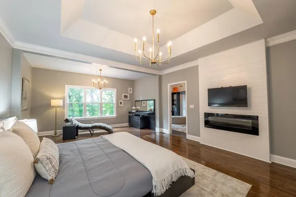 a bathroom with a sink mirror and vanity