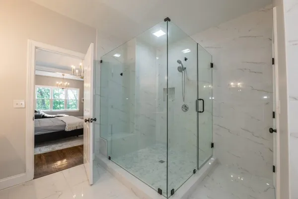 a bathroom with a sink double vanity and a mirror