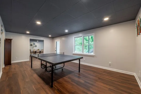 a bathroom with a sink a mirror a toilet and a shower