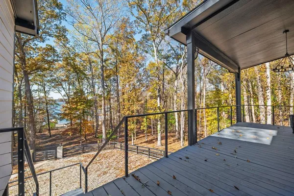 a view of balcony with wooden floor