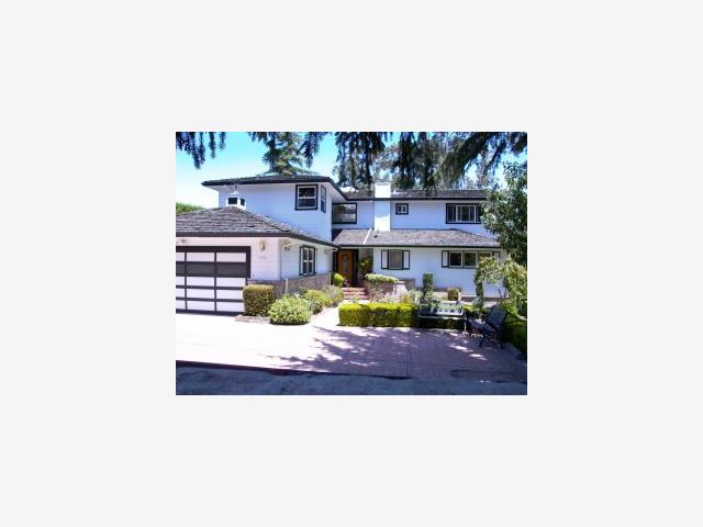 a picture of a bench in front of a building