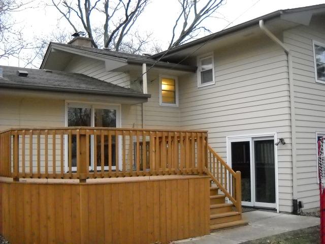 651 Wellner Road Naperville, IL 60540 - Photo 14 of 16 a view of a house with wooden fence