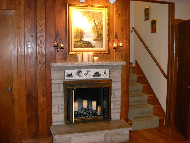 651 Wellner Road Naperville, IL 60540 - Photo 3 of 16 a view of an entryway with fireplace