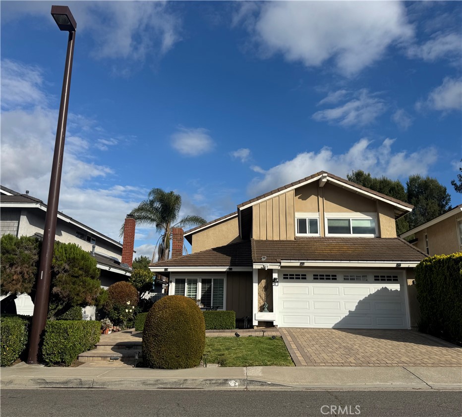 3 White Birch Irvine, CA 92604 - Photo 1 of 22 a front view of a house with a yard