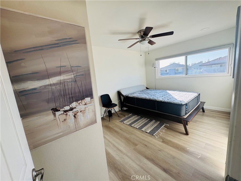 3 White Birch Irvine, CA 92604 - Photo 12 of 22 a living room with a bed furniture and a window