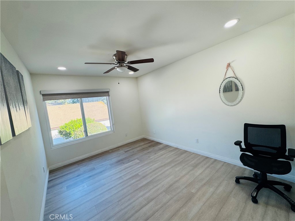 3 White Birch Irvine, CA 92604 - Photo 16 of 22 a view of room with a window and wooden floor