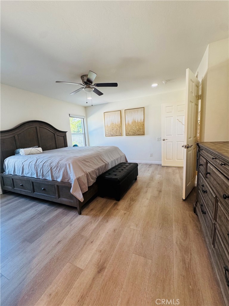 3 White Birch Irvine, CA 92604 - Photo 21 of 22 a spacious bedroom with a bed and a dresser