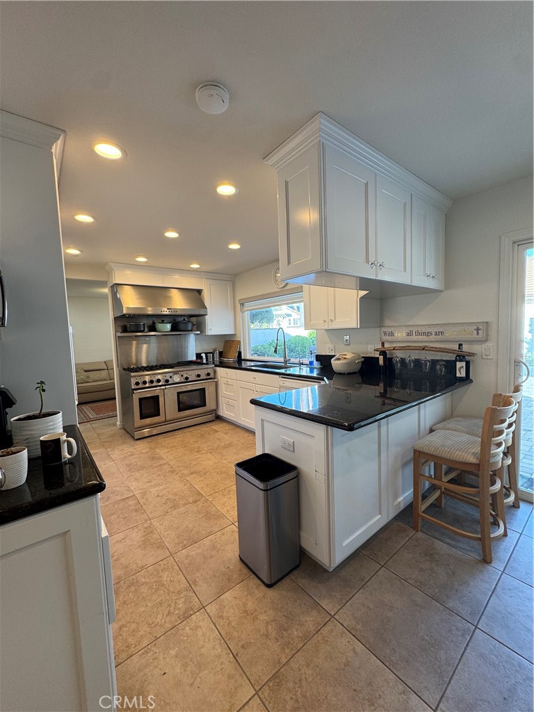 3 White Birch Irvine, CA 92604 - Photo 6 of 22 a kitchen with stainless steel appliances a stove a sink and a refrigerator