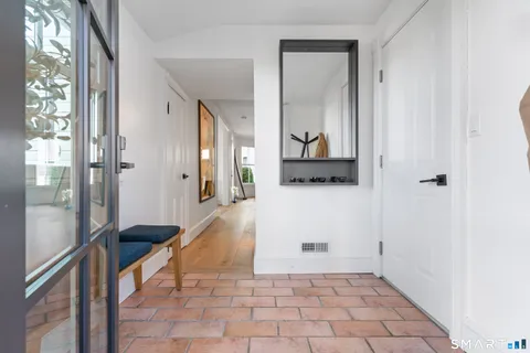 a view of a bathroom with a tub and glass door