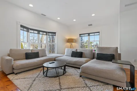 a bedroom with a large bed and a couch