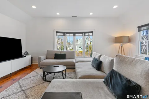 a spacious bedroom with a bed and a couch