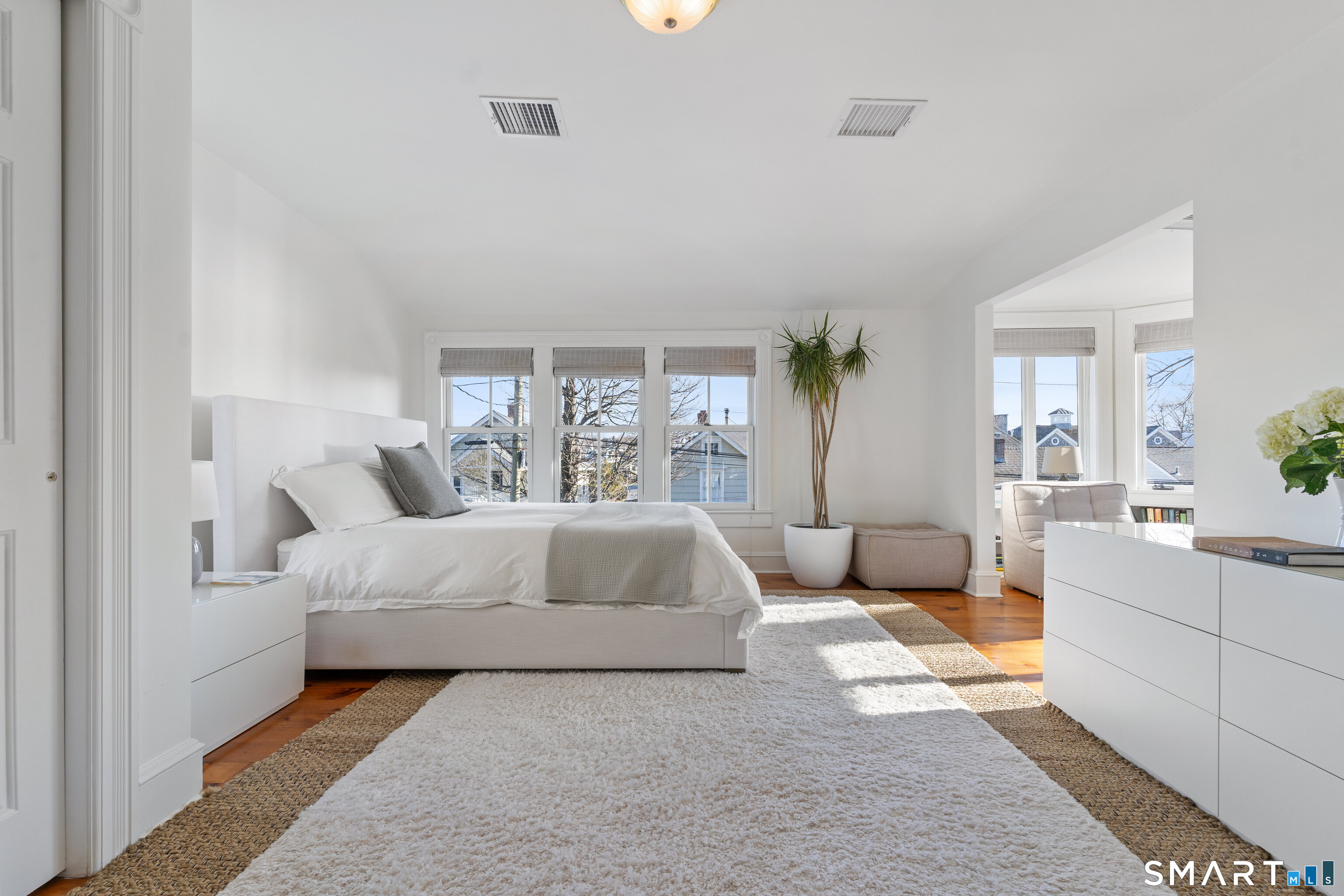 22 Ensign Road Norwalk, CT 06853 - Photo 19 of 39 a bedroom with a large bed and a couch