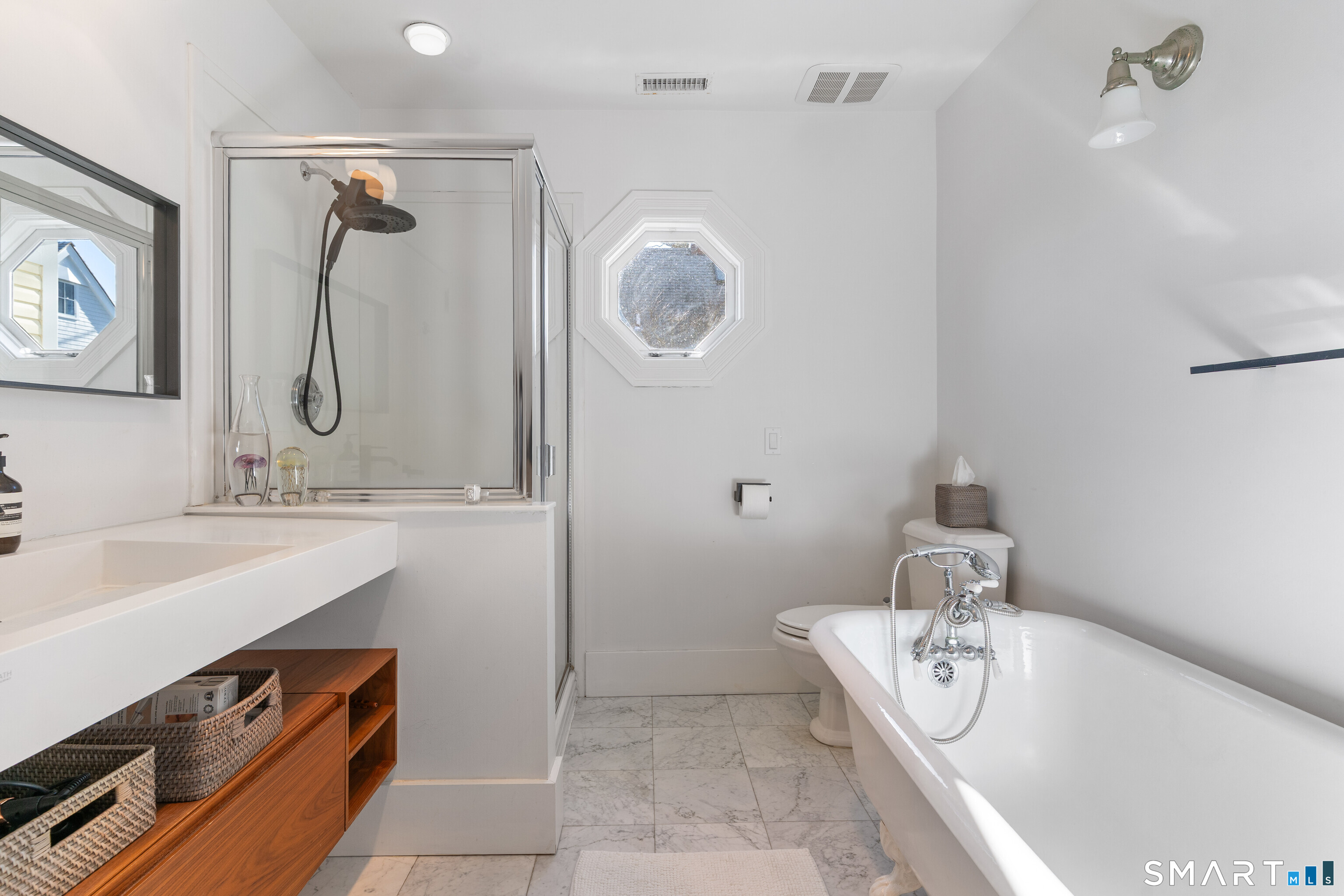 22 Ensign Road Norwalk, CT 06853 - Photo 22 of 39 a bathroom with a tub a sink and a mirror