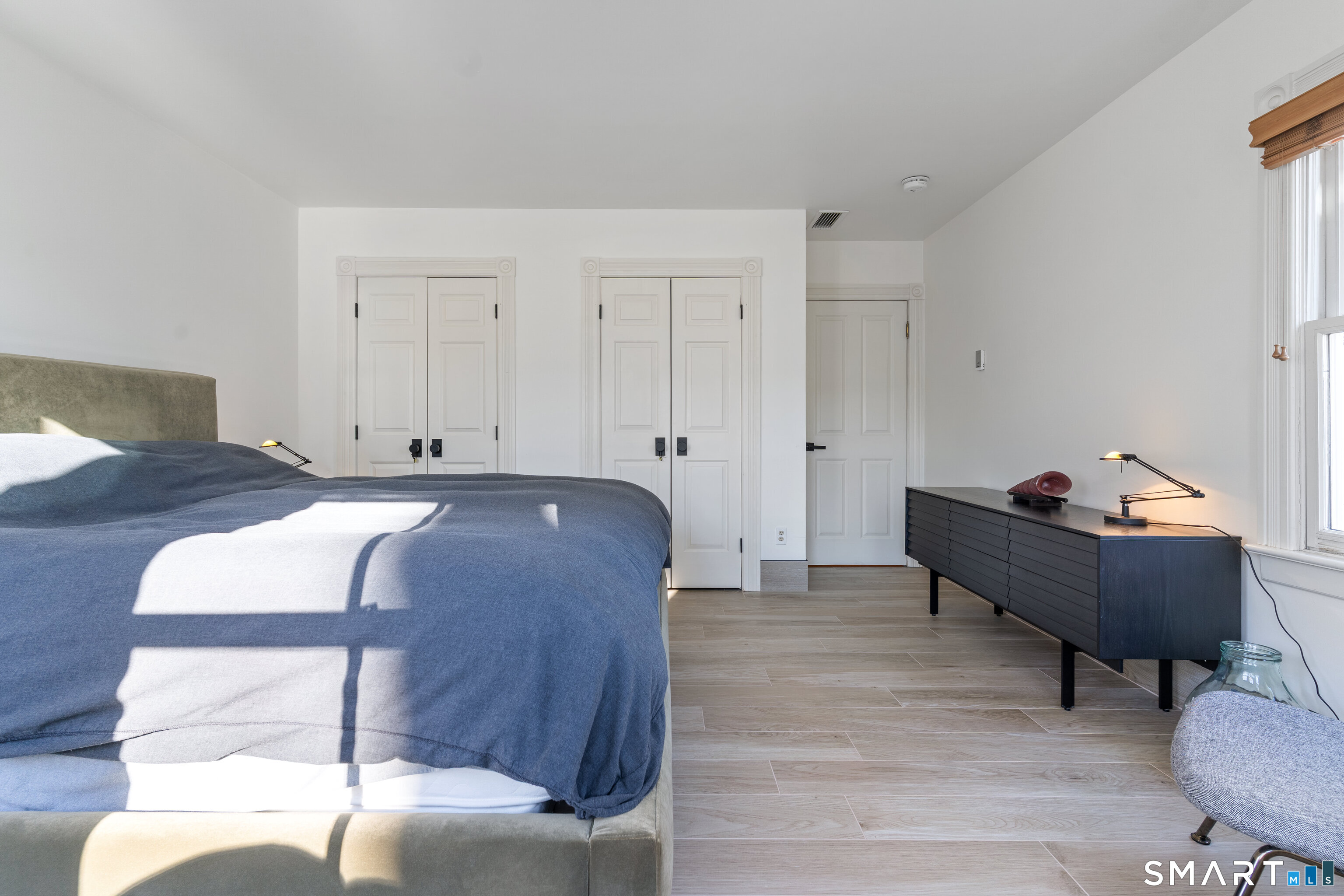 22 Ensign Road Norwalk, CT 06853 - Photo 23 of 39 a bed room with a bed and a couch