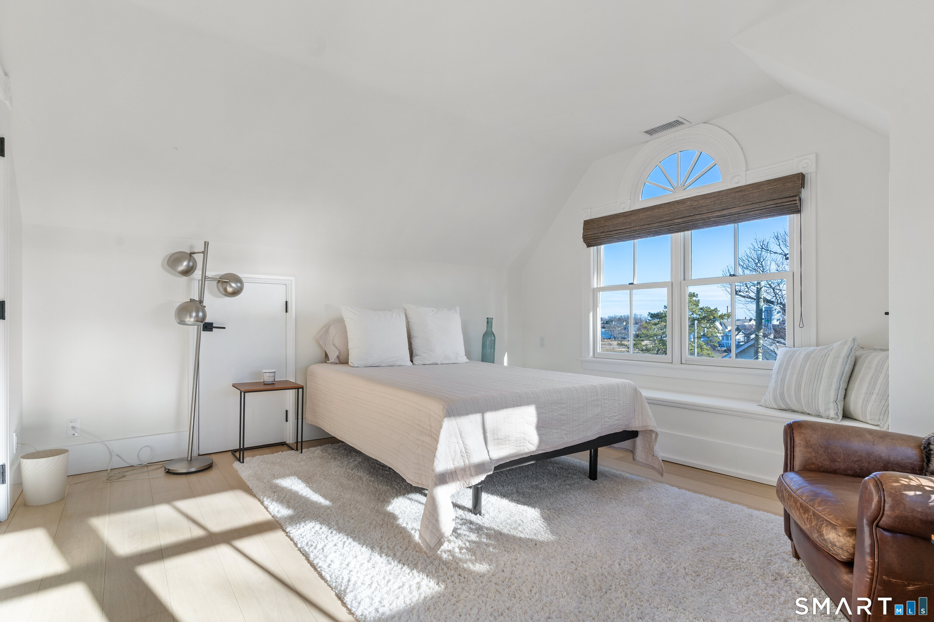 22 Ensign Road Norwalk, CT 06853 - Photo 27 of 39 a spacious bedroom with a bed and a window