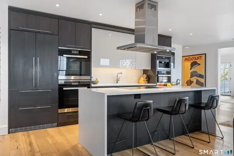 a kitchen with stainless steel appliances and wooden cabinets